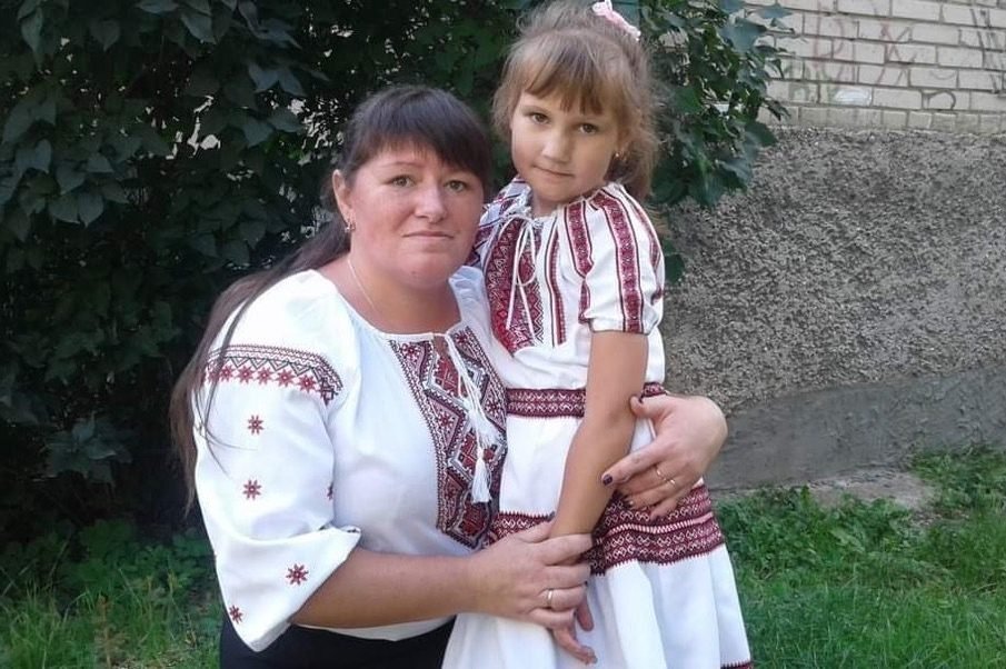 A mother and daughter in embroidered shirts, Open Your Heart project